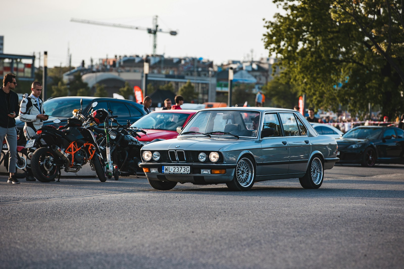 a group of cars parked in a parking lot